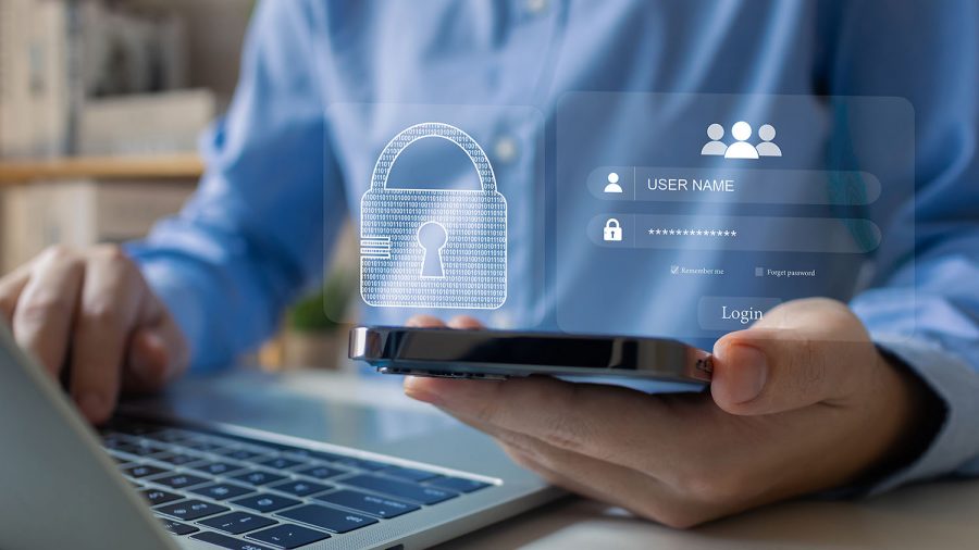 person with laptop and login screen overlay